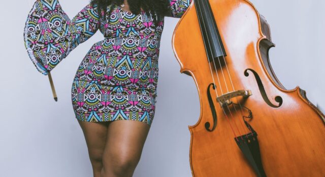 Endea Owens standing with bass
