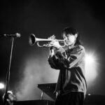 Skylar Tang on stage playing trumpet