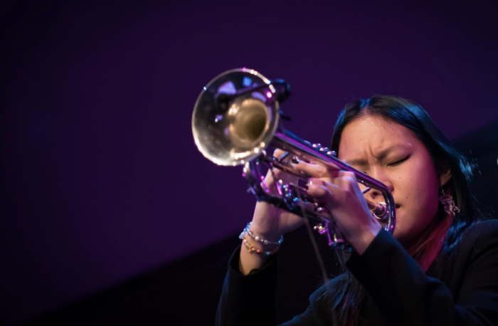 Skylar Tang close up playing trumpet